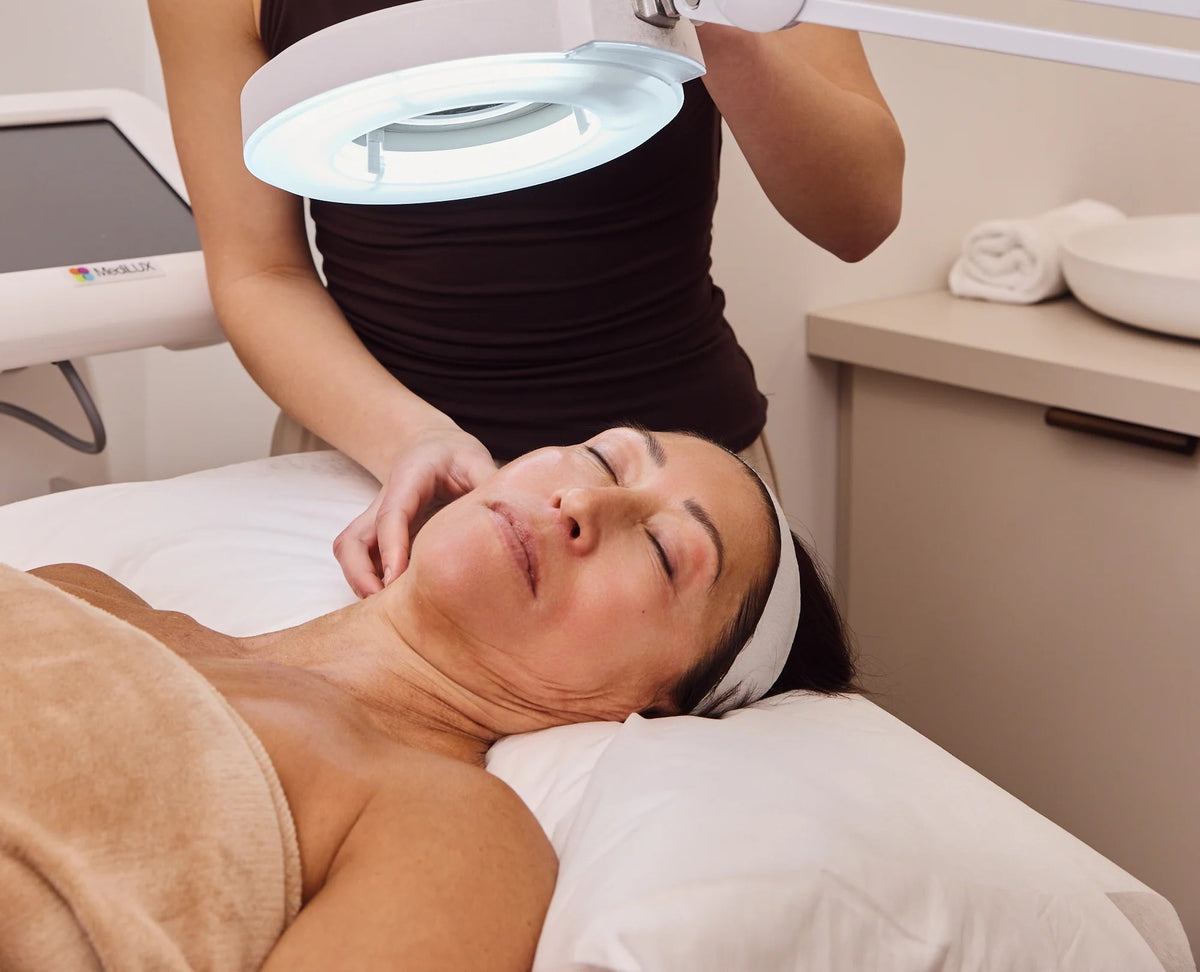 Patient relaxing during a skin assessment in a Plump Aesthetic Clinic treatment room in South Yarra
